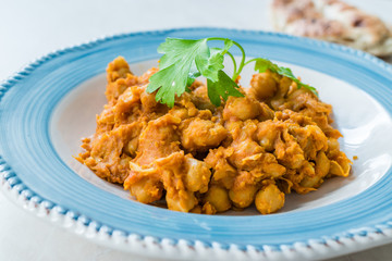 Chole or Chana Masala or Spicy Chickpeas is traditional North Indian main course recipe and usually served with Bhature or Roti/ Naan.