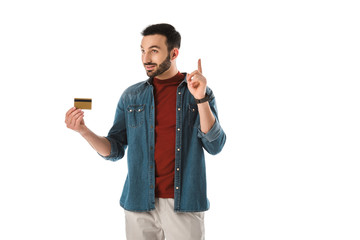 smiling man holding idea sign while holding credit card isolated on white
