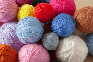 A bunch of colorful yarn balls.