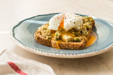 Poached Egg with Avocado Toast for Breakfast.