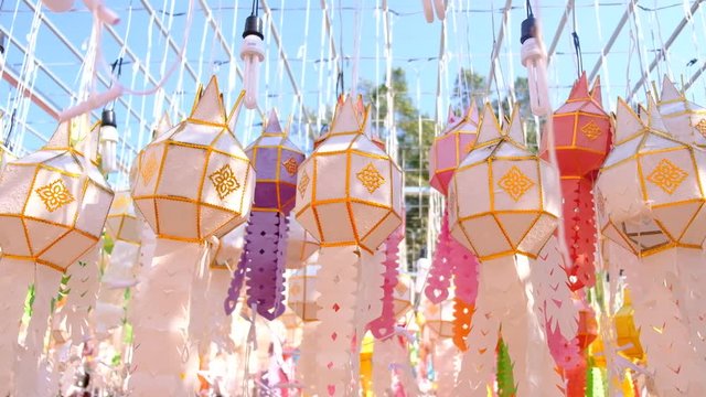 Many colorful lanterns during the Yi Peng Festival are hung from ropes in temples in northern Thailand.