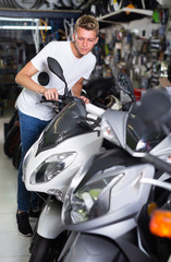 Fototapeta na wymiar Man is choosing new motorcycle