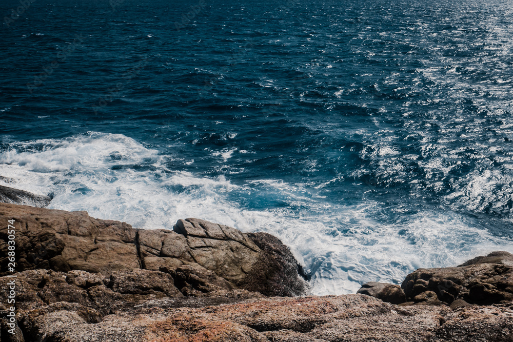 Wall mural rocky coast line of sea