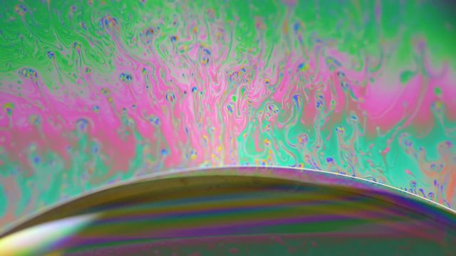 Abstract creative soap bubbles color texture.  4k close up macro of ink color in liquid water. 