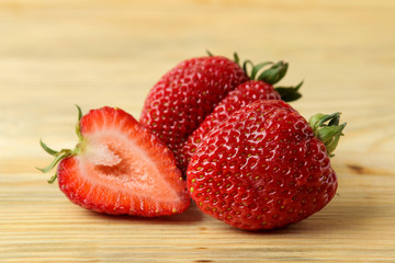 Ripe, delicious strawberries. red strawberry closeup on natural wooden table
