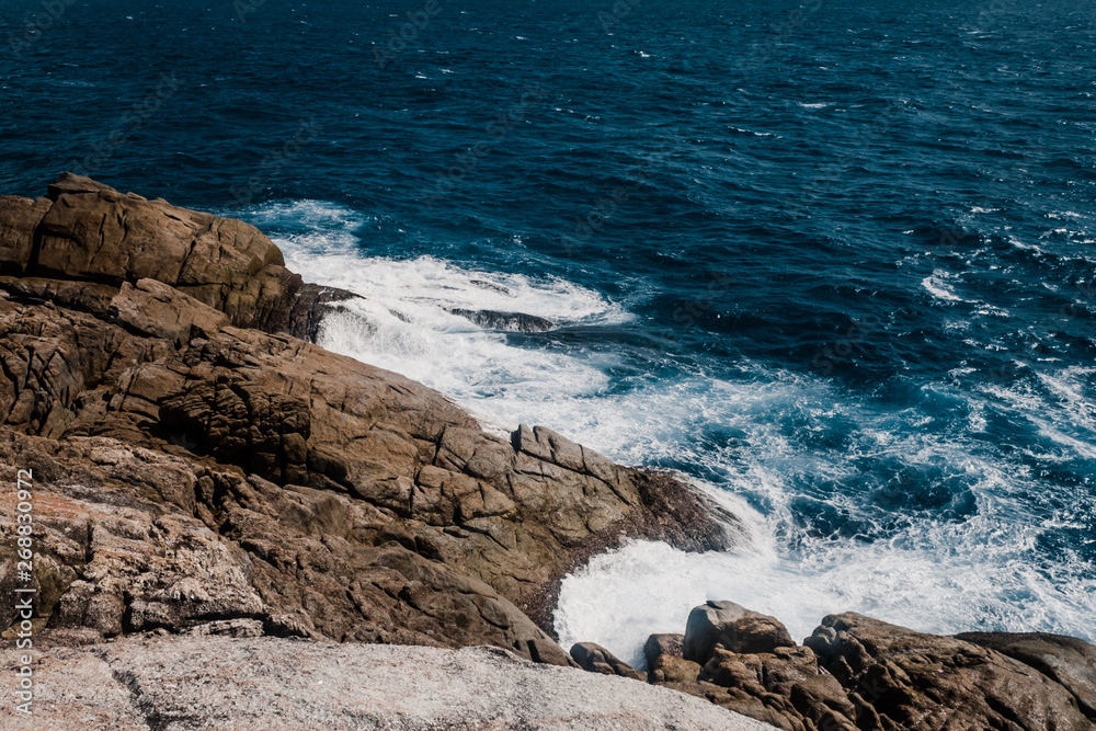 Wall mural rocky coast line of sea