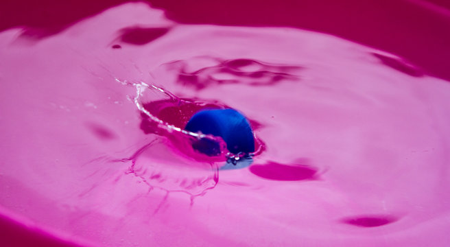 blastic bottle falling into the water spraying