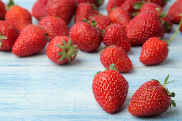 Ripe, delicious strawberries. Red berry strawberry on a light blue wooden table. close-up