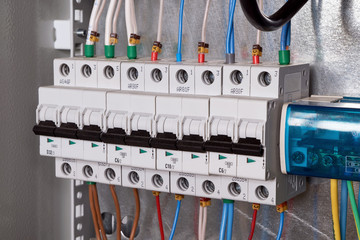 A number of electric modular circuit breakers and a cross-module for the distribution of electricity to multiple consumers in an electrical Cabinet. The wires are connected to the switches.