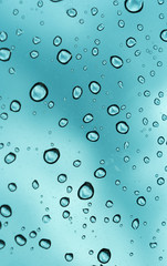 Blue background, Natural water drop on glass.