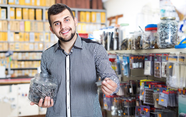 man deciding on best DIY details in houseware store