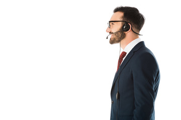 side view of call center operator in black suit and headset isolated on white