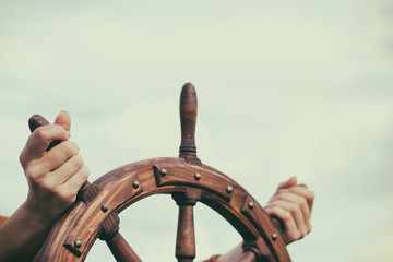 Steering hand wheel ship on sky background