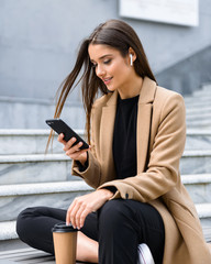 Beautiful young woman wearing autumn coat