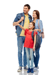 Fototapeta premium family, tourism and travel concept - happy smiling mother, father and little daughter with backpacks over white background