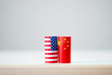 Fototapeta na wymiar USA flag and China flag for tariff trade war and tech war between United States and China who conflict because of increase tax barrier of import and export product. Government politic and business.