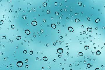Blue background, Natural water drop on glass.