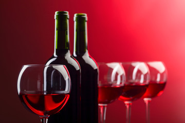 Bottles and glasses of pink wine.