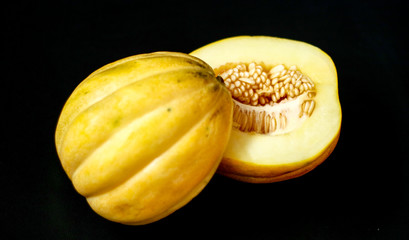 Cantaloupe or blewah on black background. 