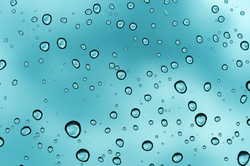 Blue background, Natural water drop on glass.