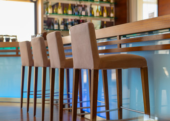 Bar counter with chairs in empty comfortable restaurant.