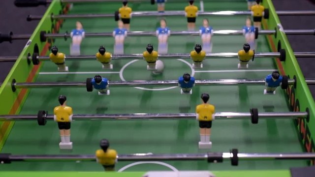 Closeup photo of plastic players in table football game