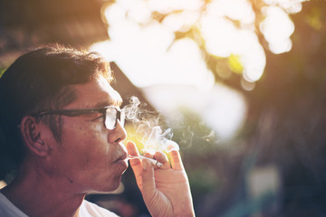 Smoker Man with blurred background, concepts for health.selective focus