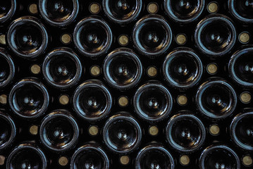 rows wine bottles in the wine cellar background