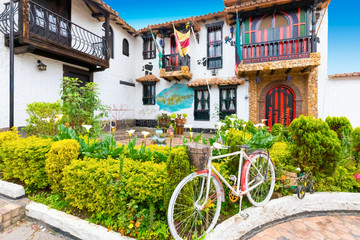 Fototapeta na wymiar Tenza typical traditional colorful houses with garden