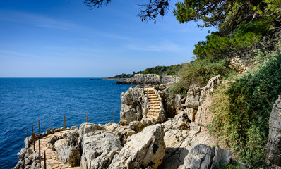 Beatiful  coastal path on the Cap d'Antibes, France. - obrazy, fototapety, plakaty