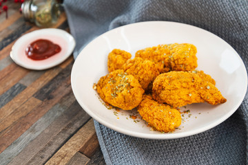Chicken Wings Spicy chicken wings, breaded, fried, cooked.