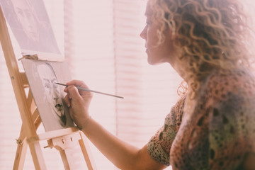 Art, creativity and people concept - caucasian closeup of woman hand painting and drawing a...