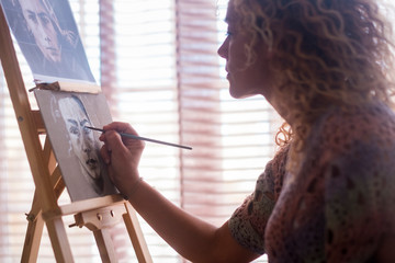 Art, creativity and people concept - caucasian closeup of woman hand painting and drawing a...
