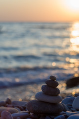 stack of zen stones on pebble beach