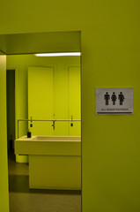 Toilet signage of all kinds next to a bathroom