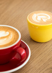 Two cups of cappuccino coffee in a cafe