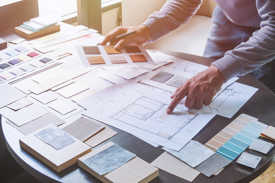 Architect designer Interior creative working hand drawing sketch plan blue print selection material color samples art tools Design Studio