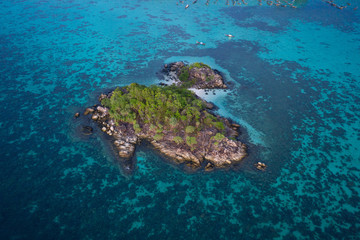 Aerial drone view of amazing tropical paradise Koh Kra island with white empty beach during sunny summer day, Thailand