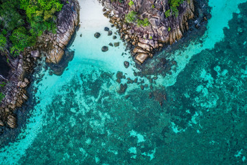Aerial drone top view of amazing tropical paradise Koh Kra island with white empty beach during sunny summer day, Thailand