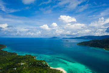 Aerial drone view of beautiful green Koh Usen island with amazing lagoon sea over summer sky background, Thailand