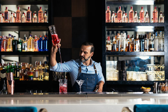 Professional young bartender working