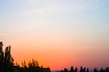 Obraz premium Landscape with dramatic light - beautiful golden sunset with saturated sky and clouds.