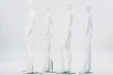 white plastic mannequins in row on white