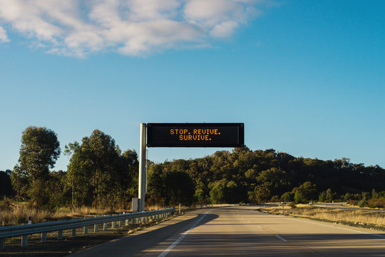 road sign for safety, stop revive survive