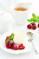 Delicious home-made dessert Panna cotta. Cream-caramel, caramel custard, with raspberries.