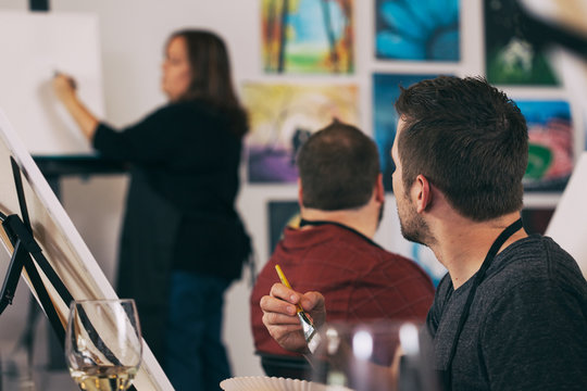 Painting: Man Paying Attention As Teacher Demonstrates