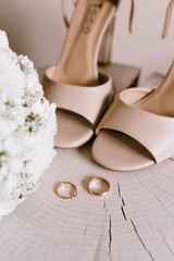 Wedding shoes and wedding paraphernalia, wedding bouquet, wedding gold rings