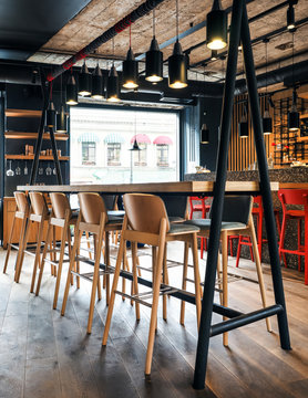 Wooden stools in modern bar