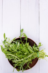 arugula salad on a plate. A bunch of greens for breakfast