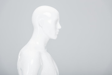 white plastic mannequin isolated on grey with copy space